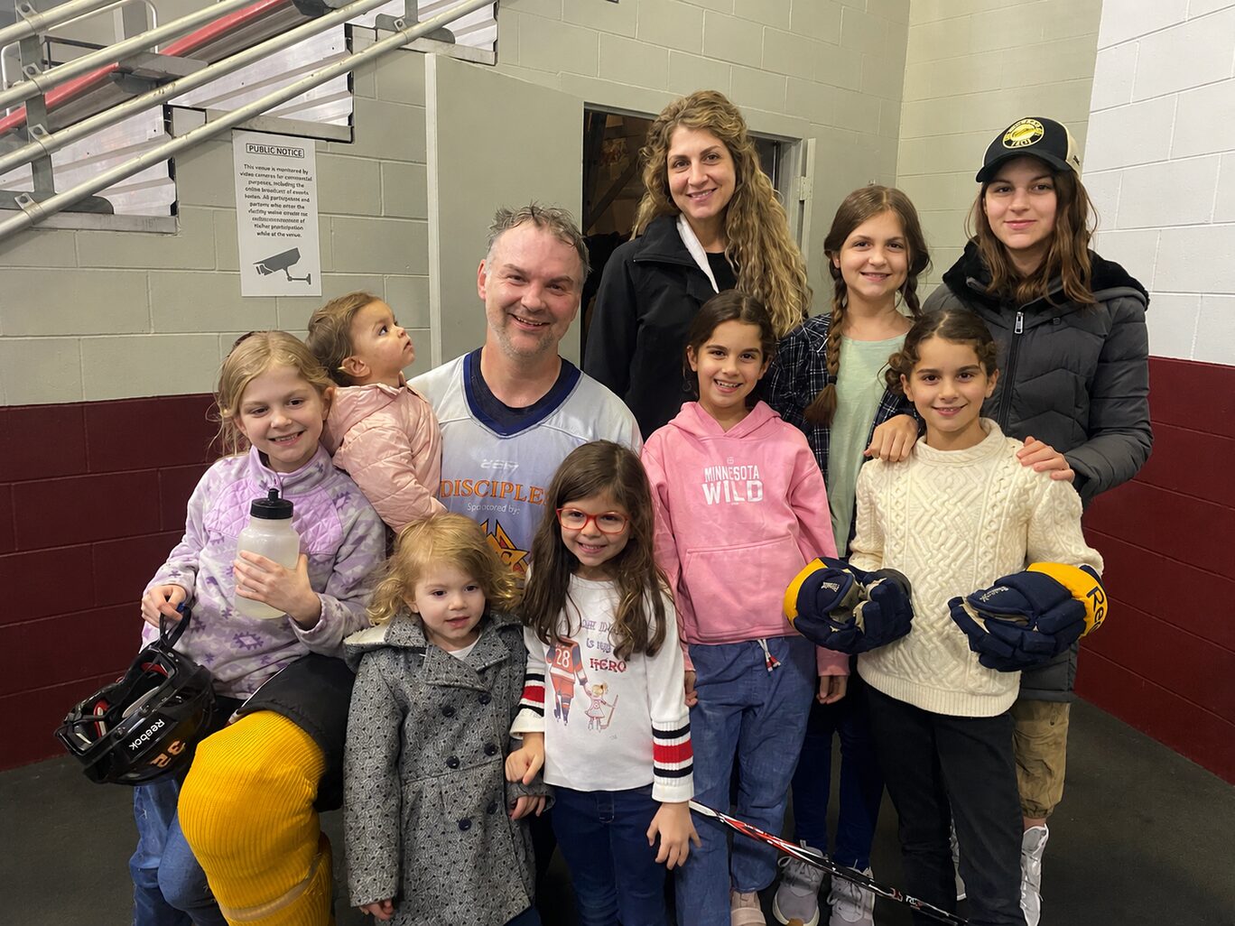 John Scott with his wife Danielle and their eight daughters