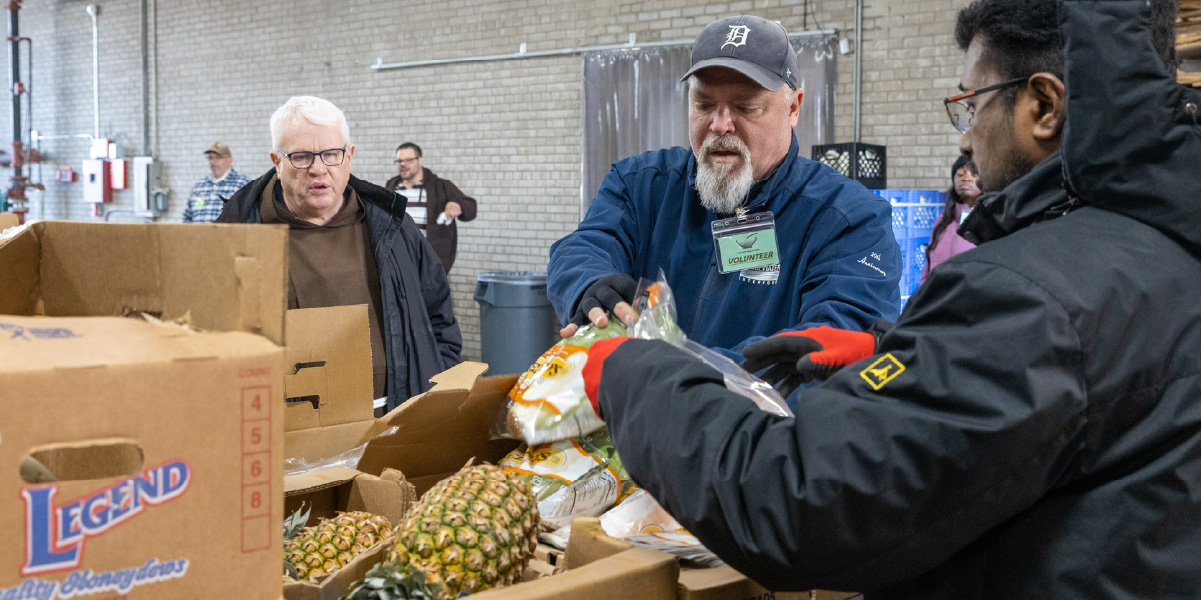 Capuchin Soup Kitchen volunteers sorting food donations
