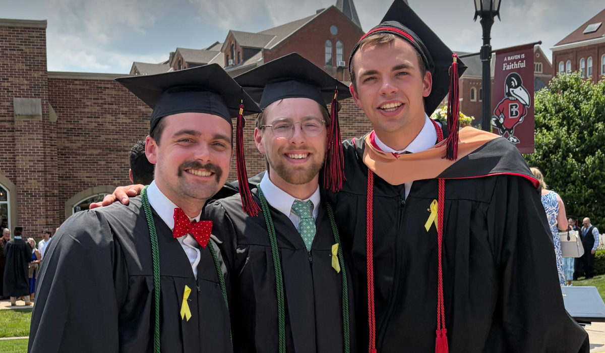Gabriel Maday (left) with fellow Benedictine graduates