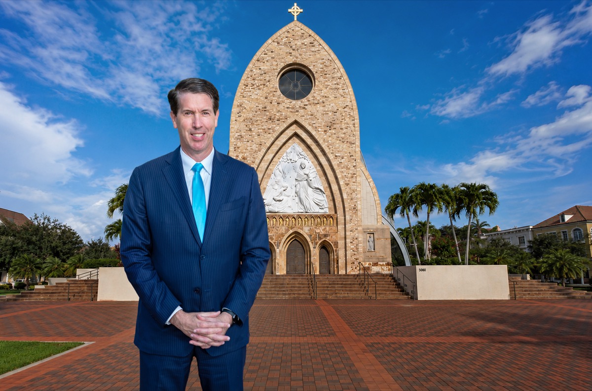 Tim Schwartz standing in front of Ave Maria Catholic Church